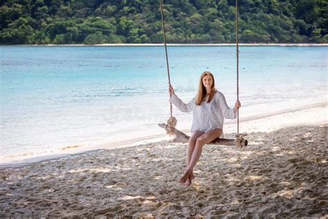 Girl Sitting On The Swing On The Tropical Beach Stock Photo Image Of