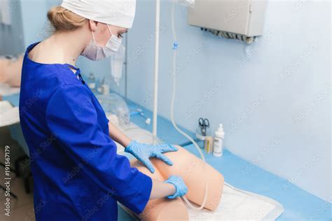 Cleaning Rectum On A Medical Mannequin Training Of A Medical Student In Process Of