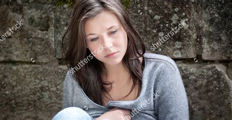 Stock Photo Outdoor Portrait Of A Sad Teenage Girl Looking Thoughtful