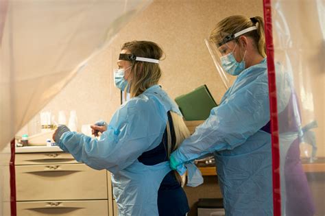 Nurses Don Ppe To Enter Quarantined Rooms Stock Photo Download Image