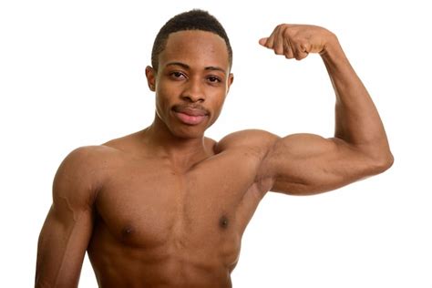 Premium Photo Portrait Of Young African Man Flexing Bicep Muscle
