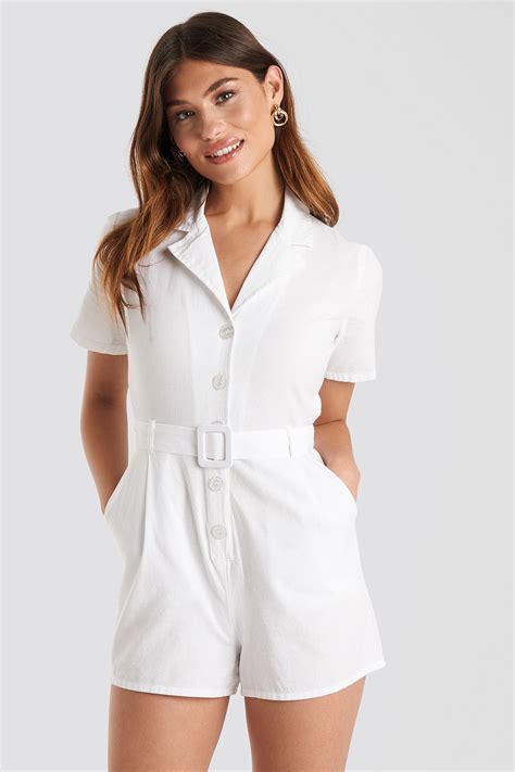 This Playsuit Features A Lapel Neckline Two Front Pockets Button