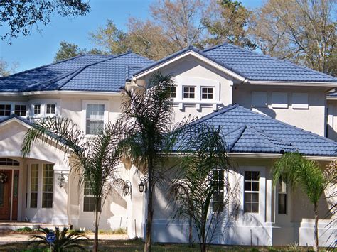 This darker blue uses the same white trim, but gets very different results. Metal Roof: Gerard Metal Roof Shingles … | House exterior ...