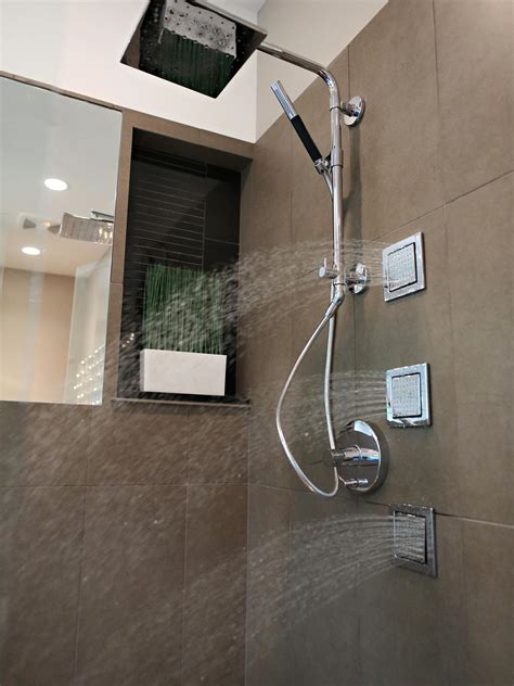 Kohler led rain shower head. Photos | Bath Crashers | DIY