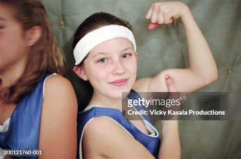 Girl Flexing Bicep Portrait High Res Stock Photo Getty Images