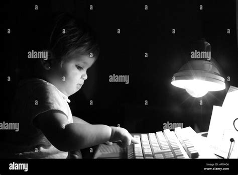 Funny Image Of A Baby Girl Typing On A Pc Keyboard Stock Photo Alamy