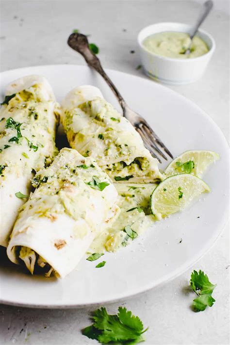 The combination is a match made in heaven and will be sure to make a comeback at your dinner table. Chicken Enchiladas with Avocado Cream Sauce Recipe | The ...