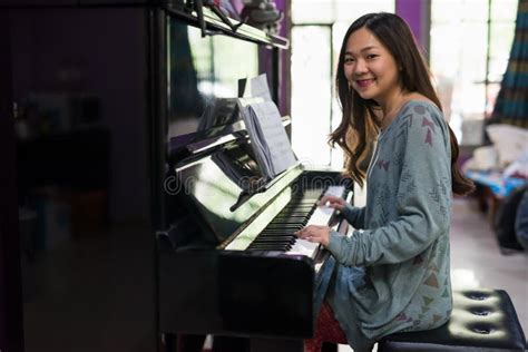 Asian Woman Playing Piano In House Stock Image Image Of Concept