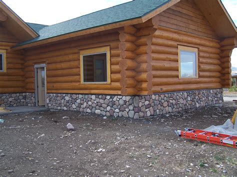 Choose from over 200 spectacular log home models, or have us custom design your log home. Stonework on Log Home | Cowboy Log Homes