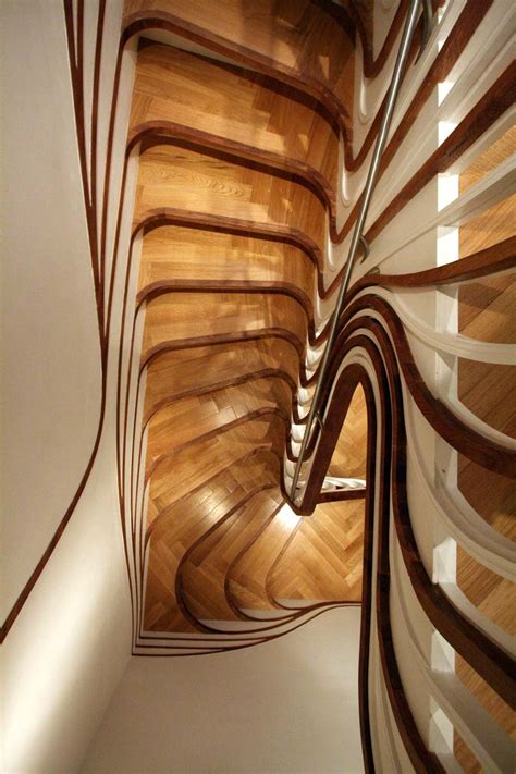 Because this look is commonly referred to as transitional but is still considered a contemporary look. Unusual Curved Staircase | DigsDigs
