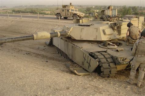 An M1a1 Abrams Tank With One Of Its Tracks Blown Off By A Land Mine
