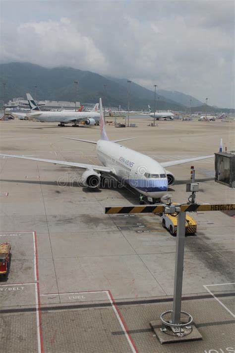 Passenger Aircraft On The Runway Of Hong Kong Editorial Photography