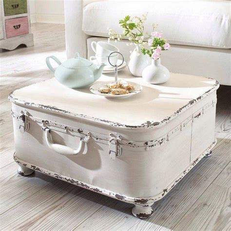 An Old Suitcase Is Used As A Coffee Table
