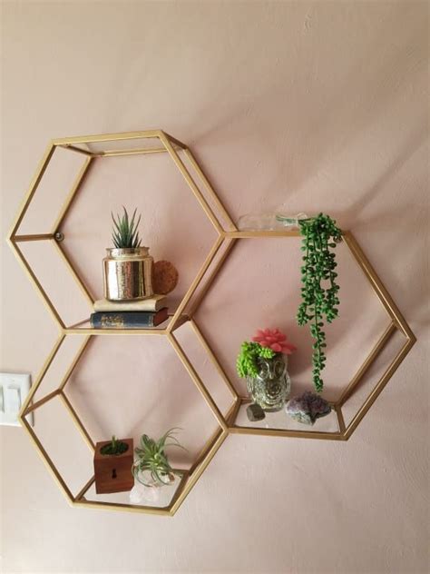 Decorative glass balls in other home décor items. Gold and Glass Honeycomb Wall Shelf | Gold bedroom decor, Luxurious bedrooms, Decor