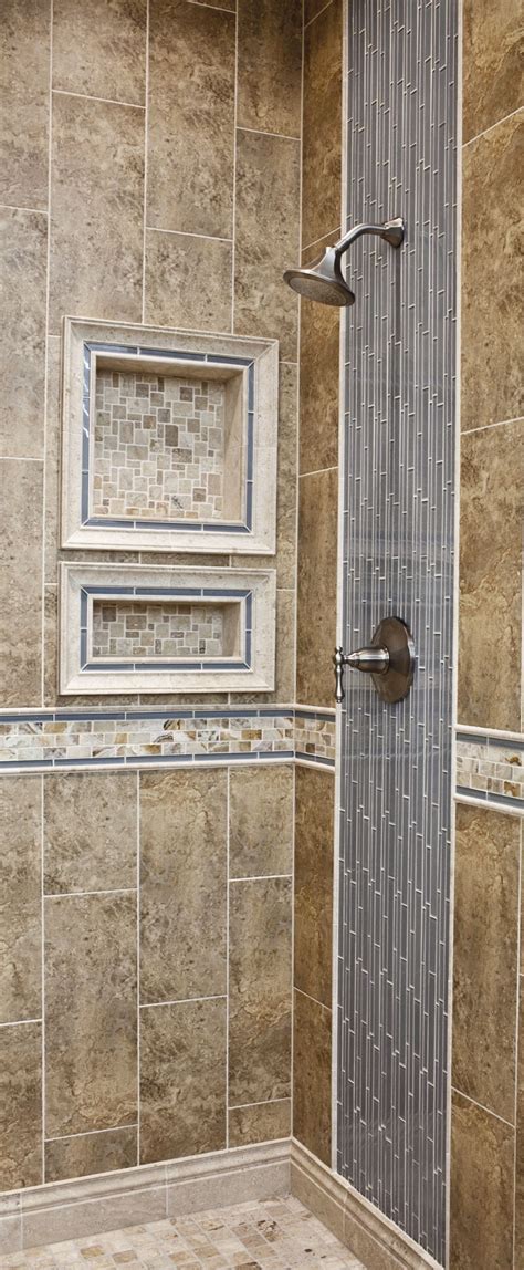 Tips to consider for your bathroom tile. Vertical tiled shower design. Glass and Ceramic wall tile ...