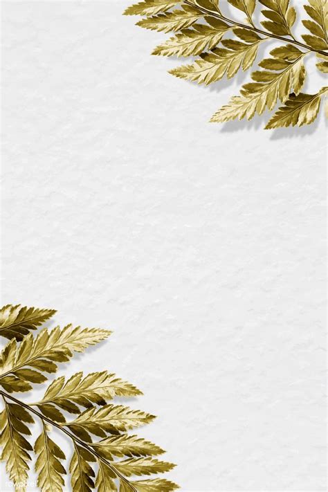 Gold Leaves On White Paper With Space For Text
