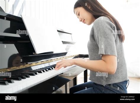 Portrait Asian Woman Playing Playing Piano Stock Photo Alamy