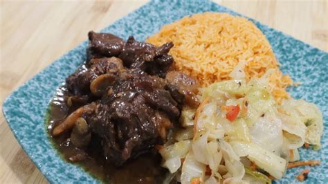 Oxtail With Jollof Rice Without Tomato Paste Cabbage On The Side