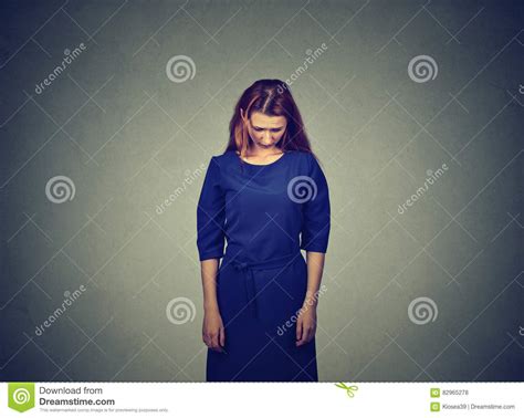Sad Shy Insecure Young Woman Standing Looking Down Stock Photo Image