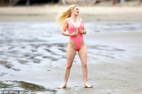 Heidi Montag Flaunts Her Ample Assets In High Cut Pink Bathing Suit