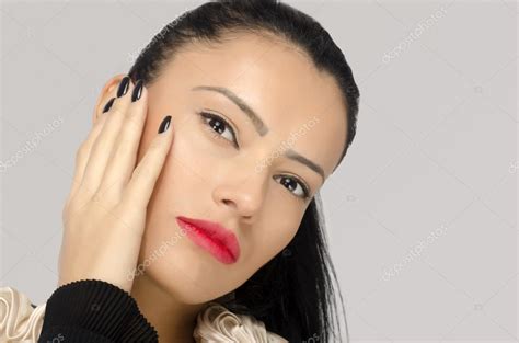 Profile Of A Brunette Woman With Red Lips Holding Her Hand