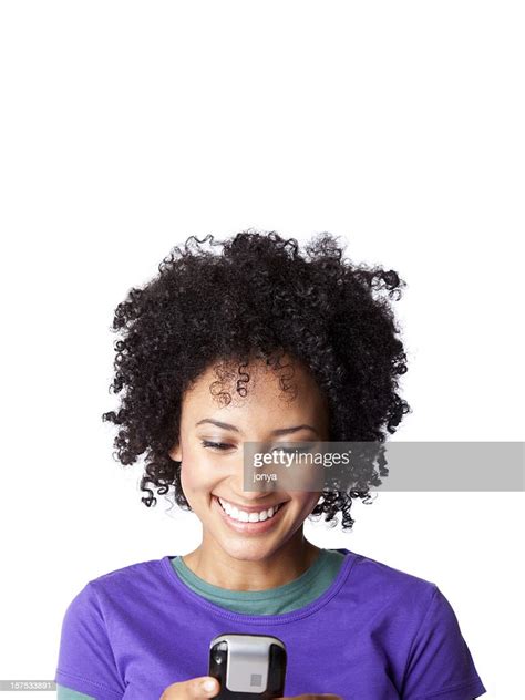 Smiling Young Woman Texting High Res Stock Photo Getty Images