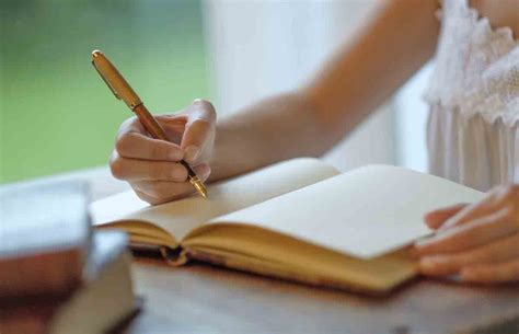 Cropped Image Of Woman Writing With Fountain Pen In Book Stockfreedom