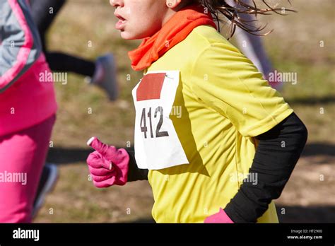 Female Athletic Runners On A Cross Country Race Outdoor Circuit