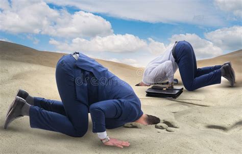 The Businessman Hiding His Head In Sand Escaping From Problems Stock