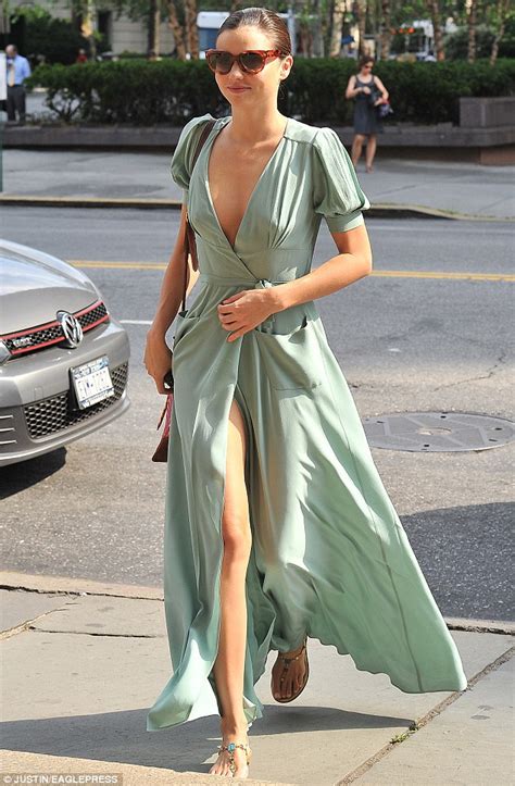 miranda kerr sexes up her floor length dress with a plunging neckline and hip high slit daily
