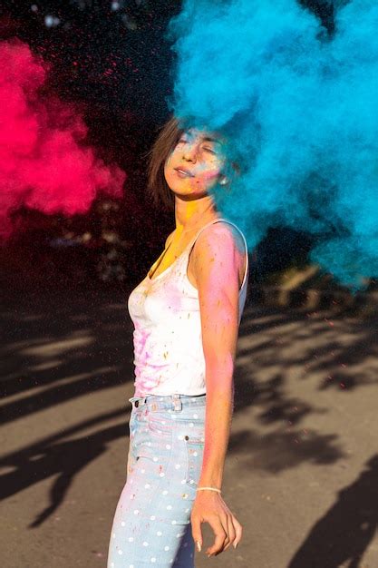 Premium Photo Lovely Brunette Woman With Short Hair Posing With Exploding Holi Red And Blue