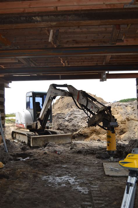 Comments and reviews about long island concrete contractors. Chance Helical Pile being Installed under a home that has ...