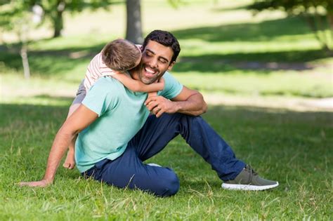 Premium Photo Father And Son Enjoying Together In Park