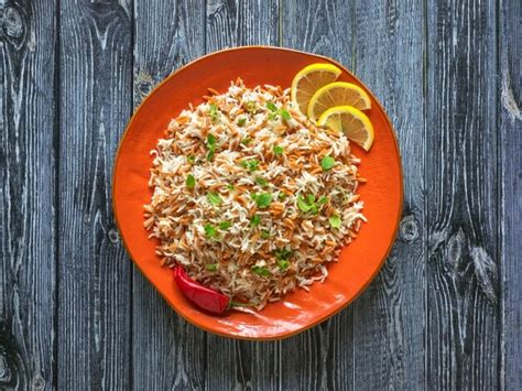 Premium Photo Turkish Rice Pilaf With Orzo In A Plate On A Dark
