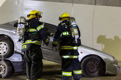 Car Accident Scene Inside A Tunnel Firefighters Rescuing People From