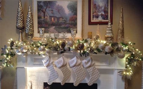 This christmas mantel decorating idea is calm and quiet. Christmas Mantle Decor with gold, cream, silver and ...
