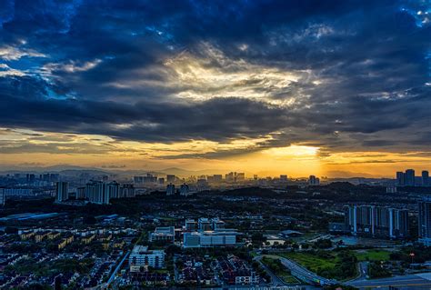City With High Rise Buildings Under Cloudy Sky During Sunset · Free