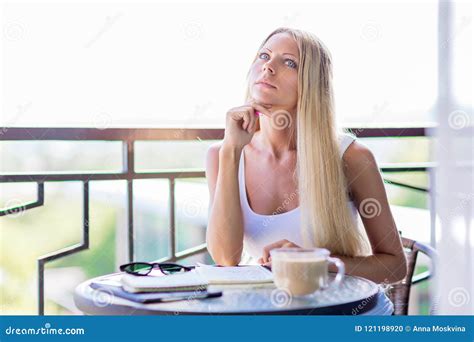 Young Woman Drink Coffee And Writing In Note Book Journal In Cafe Stock