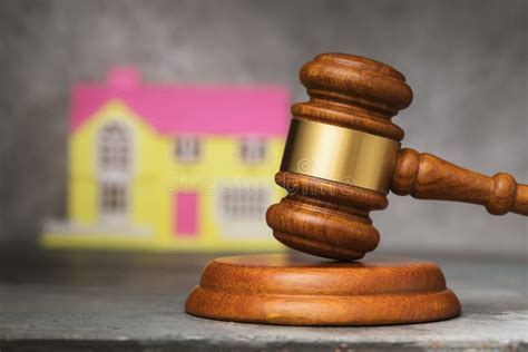 Judges Gavel And House Close Up The Concept Of Selling Real Estate At