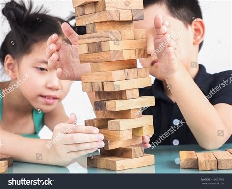 Children Playing Jenga Wood Blocks Tower Stock Photo 419097382