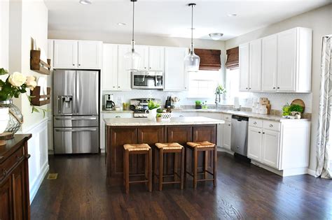 Use different colors for cabinets and island. White Cabinets, Dark Kitchen Island for Your Home