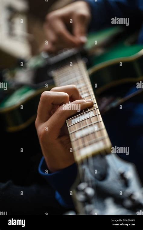 Close Up Of Fingers Strings And Frets Of Guitar Stock Photo Alamy