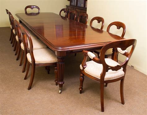 This is a beautiful beech conference table with a central tempered glass on steel legs. Vintage Mahogany Dining Table and 12 Chairs at 1stdibs