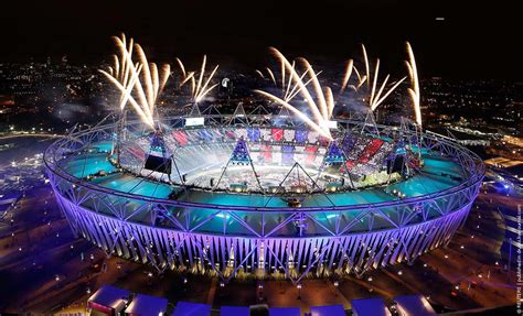 Fireworks explode over the Olympic Stadium during the opening ceremony ...