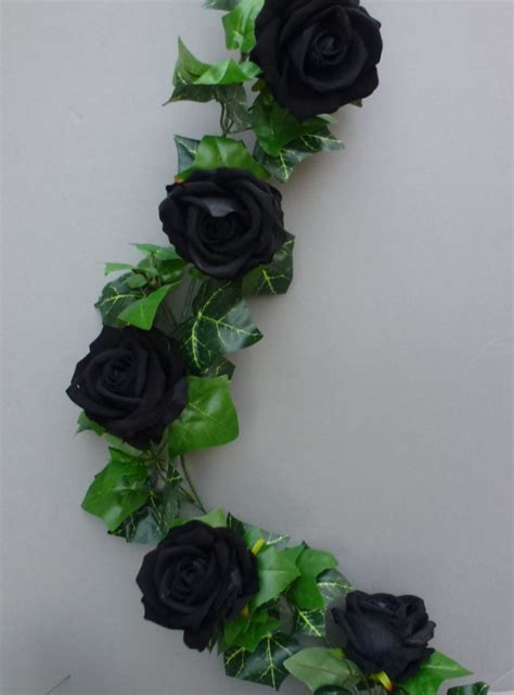 Artificial flowers provide you with the ability to show off your artistic side by creating decorative pieces or bringing character to household decor that you are showing off. Garland Gothic with artificial black roses | Artificial ...