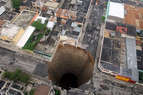 40 Dramatic Photos Of Sinkholes And Giant Craters That Swallowed Homes