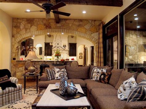 As interior design rapidly progresses, a living room wall. An arched stone wall marking the beginning of the kitchen ...