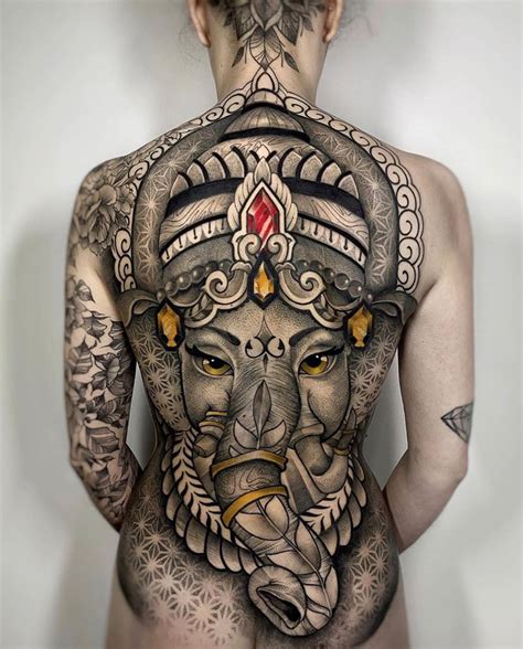 Maybe you would like to learn more about one of these? Ganesha Back Piece with Geometric Patterns