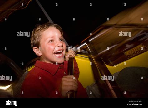 Boy Riding On A Carousel Stock Photo Alamy