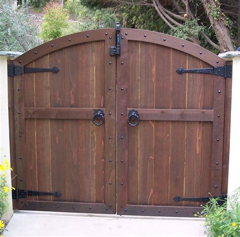 Browse photos from australian designers & trade professionals, create an inspiration board. Magnificent Brown Color Convex Shape Wooden Gate And Combine With Black Color Tee Hinges Also ...